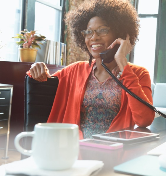 Woman listening and smiling on the phone